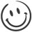 Simple black and white drawing of a classic smiley face with two oval eyes and a curved line forming a happy smile.